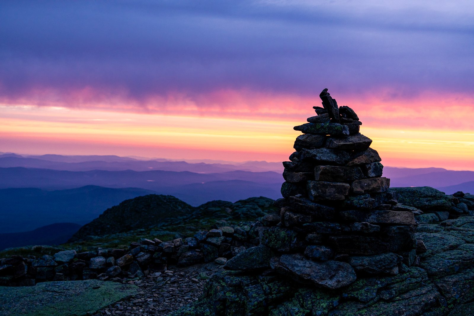 Rock cairn at sunset with twilight sky