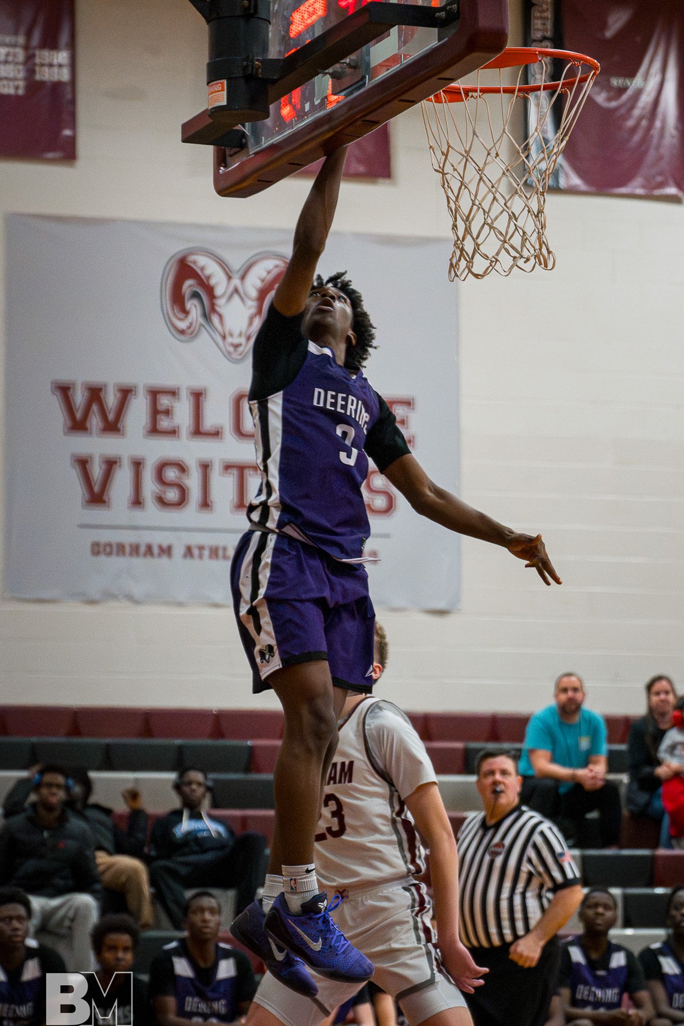 Basketball player driving to the basket for a layup